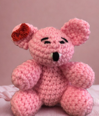 Pink crocheted teddy bear